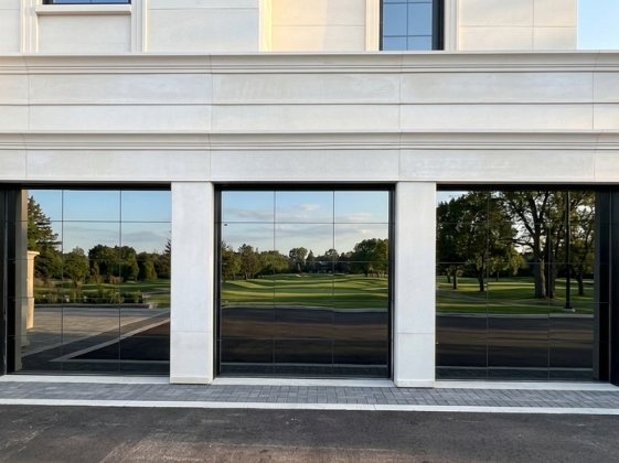 Three full-view glass garage doors