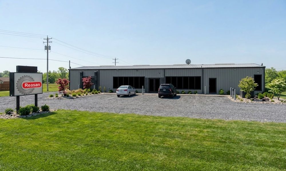 Reesan Inc. manufacturing facility with company sign